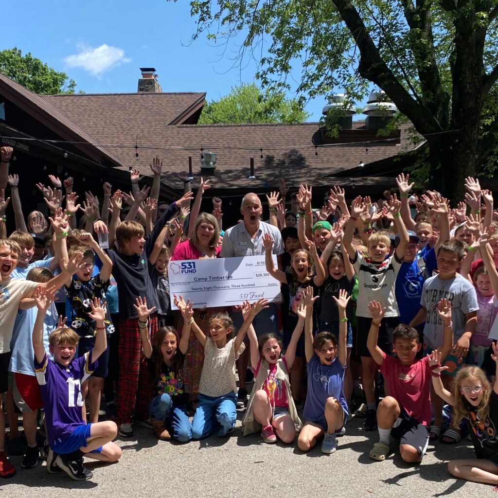 Camp Timber-lee staff and campers receiving donation check from 531Fund